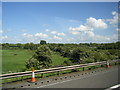 Fields and woodland north of M6 near Newton