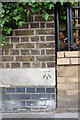 Benchmark on wall pier on St Charles Hospital, St Marks Road