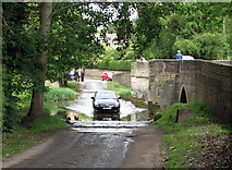 SP8982 : Geddington: crossing the ford by John Sutton