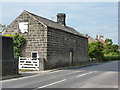 Old farm building with scene painted on door