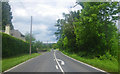 Taking the highway north through a lightly wooded area