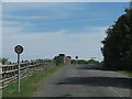 Road rises to the railway bridge at Dorton