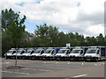 Home delivery vans parked at the back of the supermarket carpark