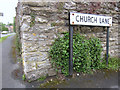 Corner of Church Lane and a bench mark