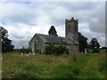 N2738 : Church in overgrown churchyard by John M