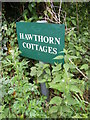 TM4266 : Hawthorn Cottages sign by Geographer