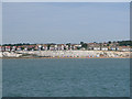 Beach huts on Stone Bay, from the sea