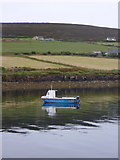 HY4327 : Rousay: boat and fields by Chris Downer