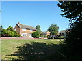 Houses glimpsed on the footpath from West Street to Coach Hill