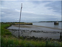 TQ5576 : Muddy bay at low tide by Marathon