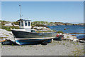 Boat beside jetty at Flodabay (Fleoideabhagh)