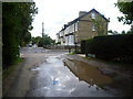 A rather large puddle in Clarence Road, Bickley