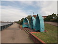 Three boats beside the River Thames