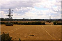 SU4794 : Harvested fields under the wires by Steve Daniels