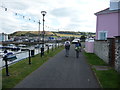 Walkers beside the harbour in Aberaeron