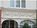 Pretty putti on a house in Blenheim Gardens, NW2