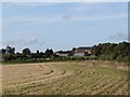 Peppering High Barn seen across stubble fields