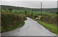 SX8879 : Exeter Road Biddlecombe Cross in the rain by roger geach