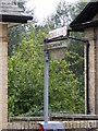 Roadsign to the Cemetery & Bowls Club