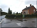 Junction on B3177, with Four Elms Farmhouse