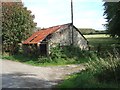 Old barn by road and path in Cranbrook