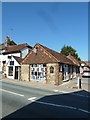 Looking across the High Street towards a stationery shop