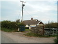 Terminal electricity pole looms over Berllan Bungalow