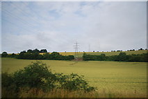 SU7314 : Pylons crossing Idsworth Down by N Chadwick