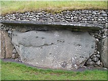 O0072 : Carved stone in the rear outer wall of the Newgrange Tomb by Eric Jones