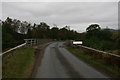 NM9877 : A861 and bridge over Garvan River by Peter Bond