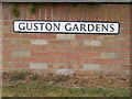 Guston Gardens sign