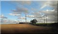 Power lines and telcomms mast from an East Coast train