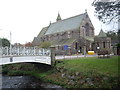 Access by footbridge to St James the Great church