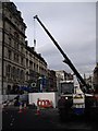 Installing a new street clock (2), St Mary St, Cardiff