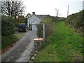 Track skirting a cottage