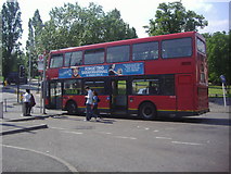 TQ2266 : Bus outside Worcester Park station by David Howard