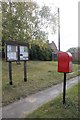 Postbox and noticeboard