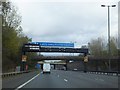 Motorway gantry over M5, with footbridge and road bridge beyond