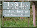 TM4477 : The Stables at Henham Park sign by Geographer