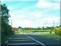 N3897 : Sharp bend and road junction on the N55 at Garrymore, Ballinagh by Eric Jones