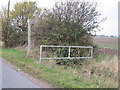 Footpath sign and small bridge over ditch