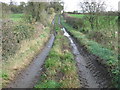 SJ6769 : A muddy farm track beside Whatcroft Hall by Dr Duncan Pepper
