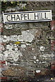 Benchmark on wall at Chapel Hill/Treyew Road junction