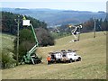 Installing a new electricity transmission line.