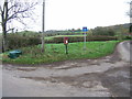 Grit-bin, telegraph pole, postbox and road sign