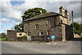 The Manor House, an island on the A684