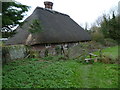 Footpath reaches cottage at Wepham