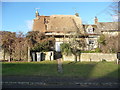 Re-thatching a cottage in Finstock High Street