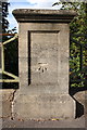 Benchmark on pier of bridge over River Thames