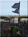 SZ1891 : Mudeford: two black flags flutter in the wind by Chris Downer